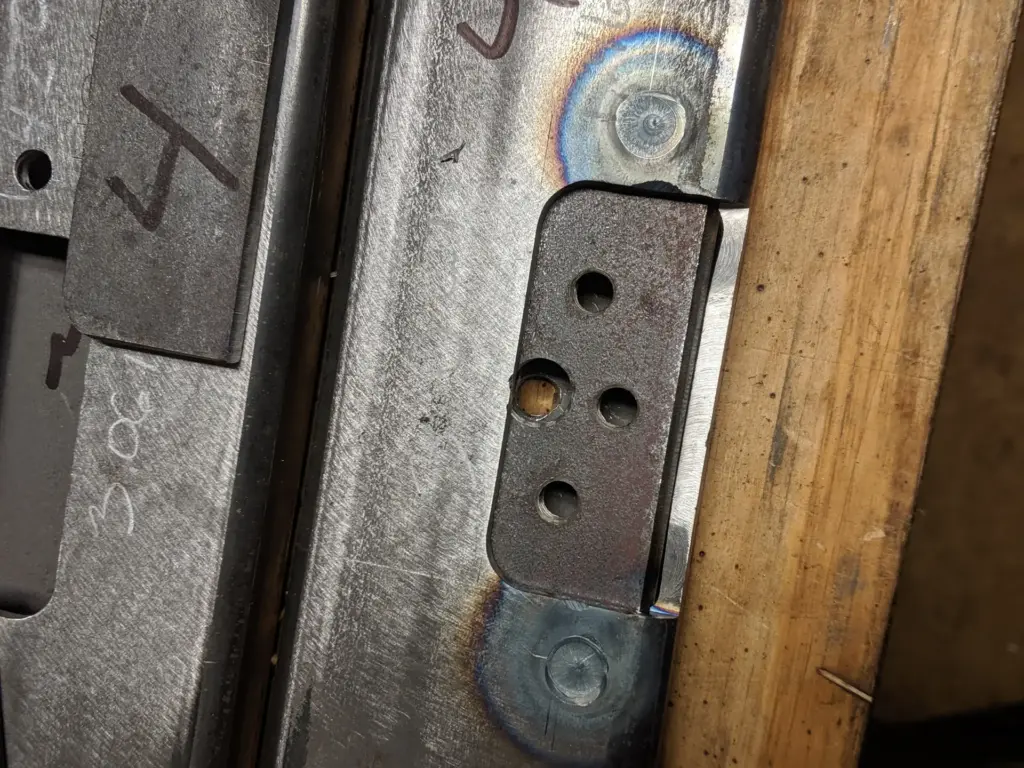 Steel hinge plate welded into the door frame on a custom IronMann steel door